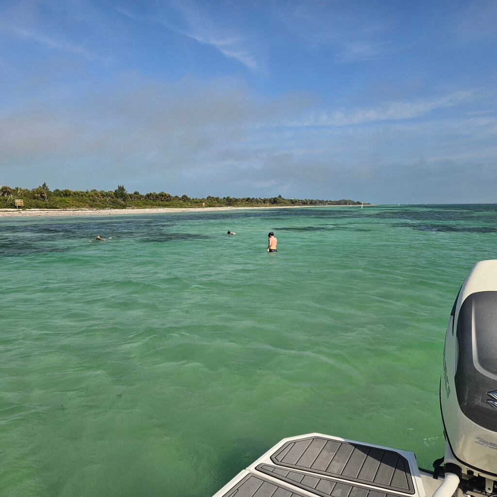 A Wakeboarding gliding around Tampa Bay area.